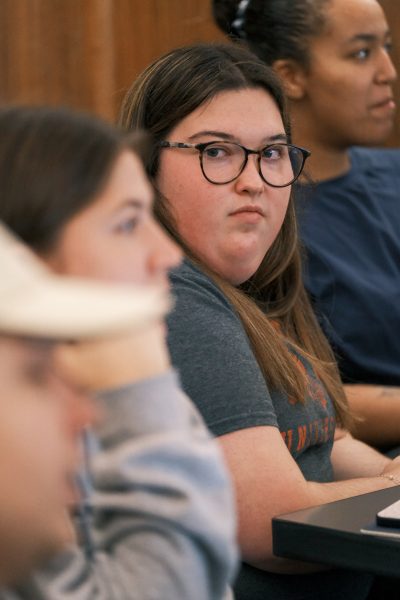 Line of students watching professor during lecture