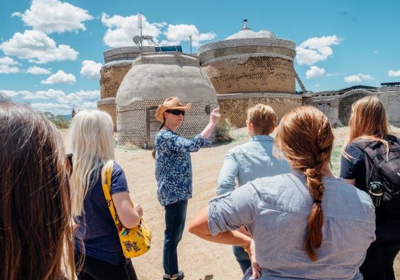 Photos of students at the The Greater World Earthship Community during the 2016 seminar Landscape and Memory in the American Southwest